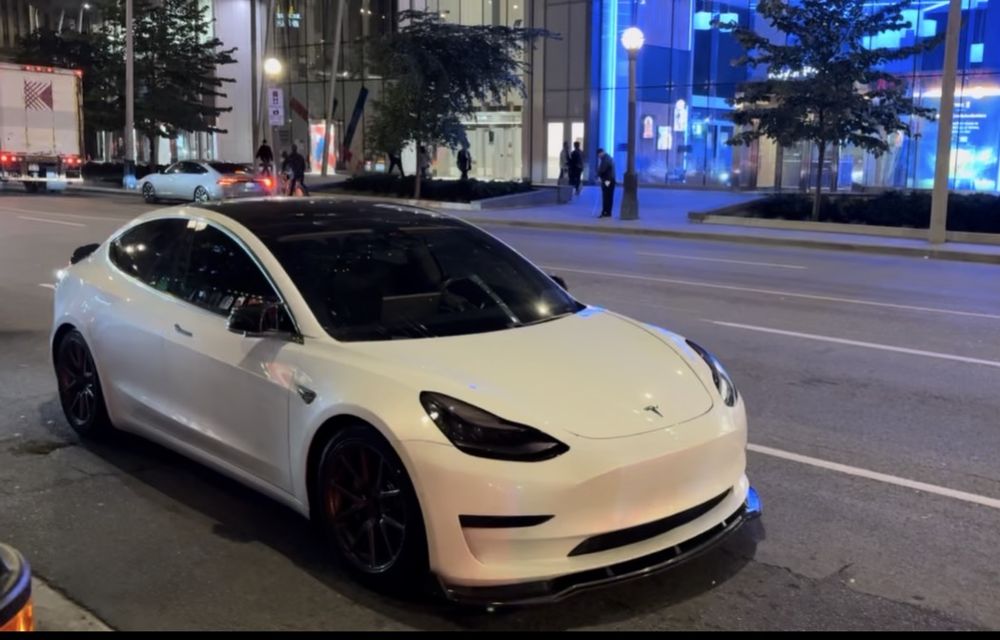White Tesla Model 3 downtown